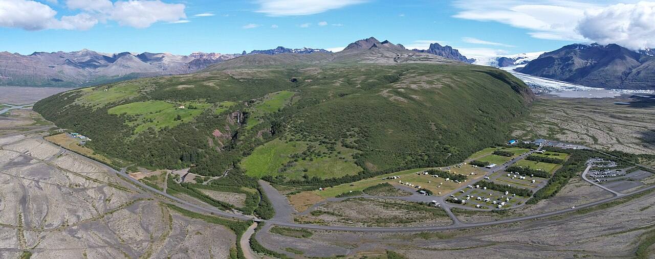 Aerial view of Skaftafell green ridges, roads and glacier foreland